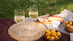 The purpose of the image is to show what picnic dates are—a relaxing and intimate way to spend time outdoors with good food, drinks, and nature. It highlights the casual vibe and charm of a picnic date, capturing the essence of enjoying a simple and creative dining experience in a beautiful outdoor setting.