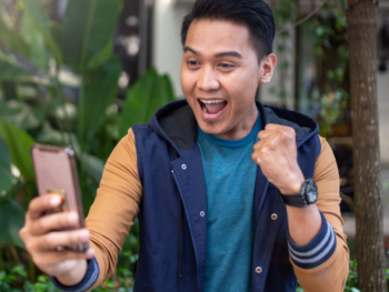 This image captures a guy who looks thrilled while looking at his phone—maybe he just got some exciting news or a positive message. It’s a moment full of joy and confidence. When thinking about "what is the right mindset for dating," this image reflects exactly that—being upbeat, open to new possibilities, and celebrating small wins. In dating, having a positive and confident mindset can make all the difference, just like this guy is showing with his reaction!