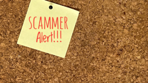 This photo serves as a reminder to watch out for scammers. If you're wondering what are the red flags of a scammer, they often include asking for sensitive personal information, offering deals that seem too good to be true, creating a sense of urgency to push you into quick decisions, and inconsistent communication. 