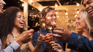 This photo captures a couple enjoying the magic of the holidays with sparklers. Do holiday romances last? Some become lasting love, while others remain special seasonal memories.