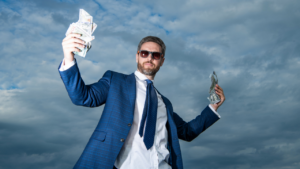 The image explores the question, "Does money make you attractive?" by showing a man in a powerful, affluent pose, implying a link between wealth and attractiveness.