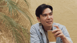 Confident introverted man relaxing in a cozy cafe and enjoying quiet time