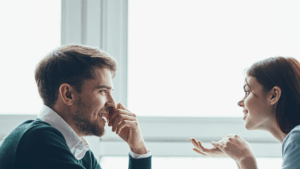 Introverted man having a meaningful one-on-one conversation, confidently expressing deeper values and traits instead of just listing interests to build genuine attraction.