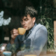 Reflective coffee moment showing how introverted men can have better first dates by leading with calm presence