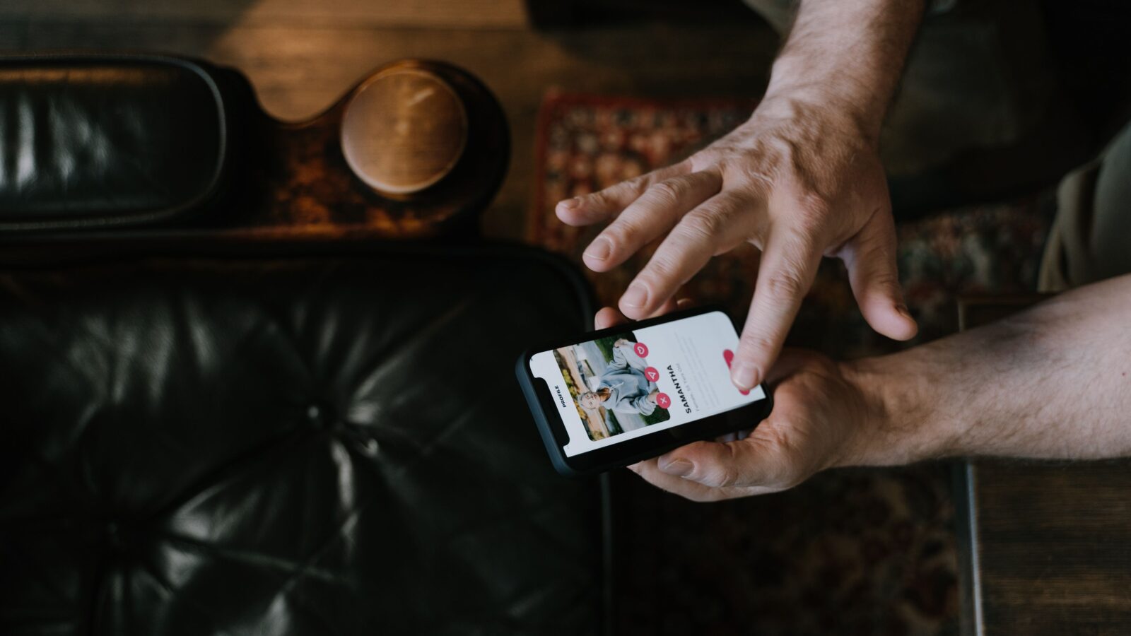 Student man using phone to build a standout online dating profile