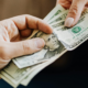 Man handing cash to pay for a date, a common sign of a foodie call